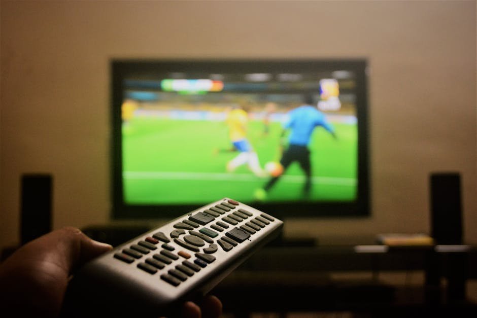 Modern smart TV displaying IPTV interface with multiple channel options and streaming content in 2026