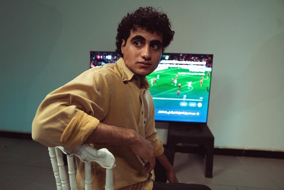 Sports fan enjoying World Cup 2026 match on smart TV with IPTV streaming service